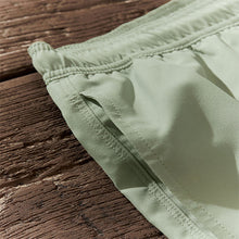 Load image into Gallery viewer, Light Green Palm Logo Essential Swim Shorts