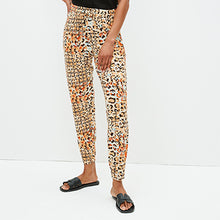 Load image into Gallery viewer, Orange Animal Print Jersey Joggers