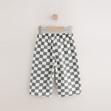 Load image into Gallery viewer, Black/White Checkerboard Pull On Wide Trousers (3mths-6yrs)