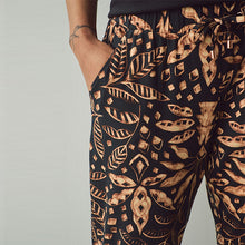 Load image into Gallery viewer, Black Leaf Print Jersey Joggers