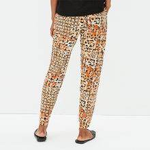 Load image into Gallery viewer, Orange Animal Print Jersey Joggers
