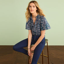 Load image into Gallery viewer, Blue Floral Textured Cotton Short Sleeve Tie Neck Blouse
