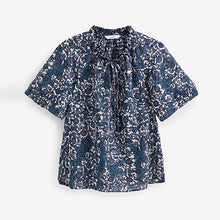 Load image into Gallery viewer, Blue Floral Textured Cotton Short Sleeve Tie Neck Blouse
