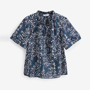 Blue Floral Textured Cotton Short Sleeve Tie Neck Blouse