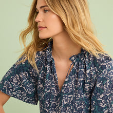 Load image into Gallery viewer, Blue Floral Textured Cotton Short Sleeve Tie Neck Blouse
