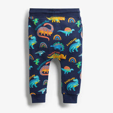 Load image into Gallery viewer, Navy Rainbow Dino All Over Print Jersey (3mths-5yrs) - Allsport
