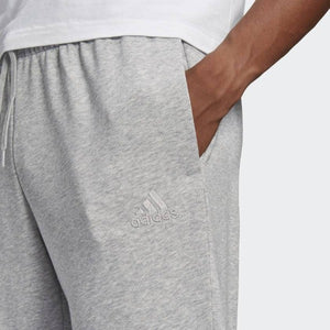 ESSENTIALS FRENCH TERRY TAPERED CUFF LOGO PANTS - Allsport